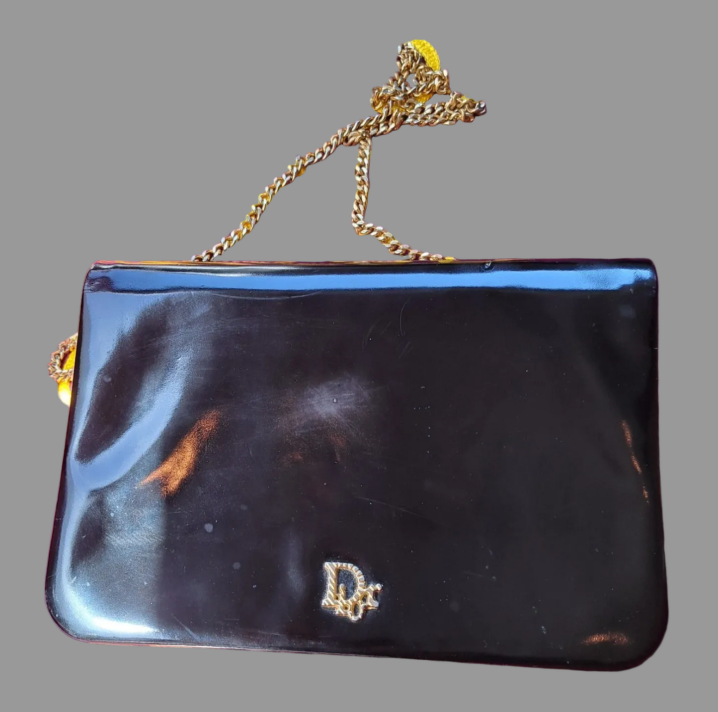 Dior shiny black leather two way envelope purse with a gold chain strap