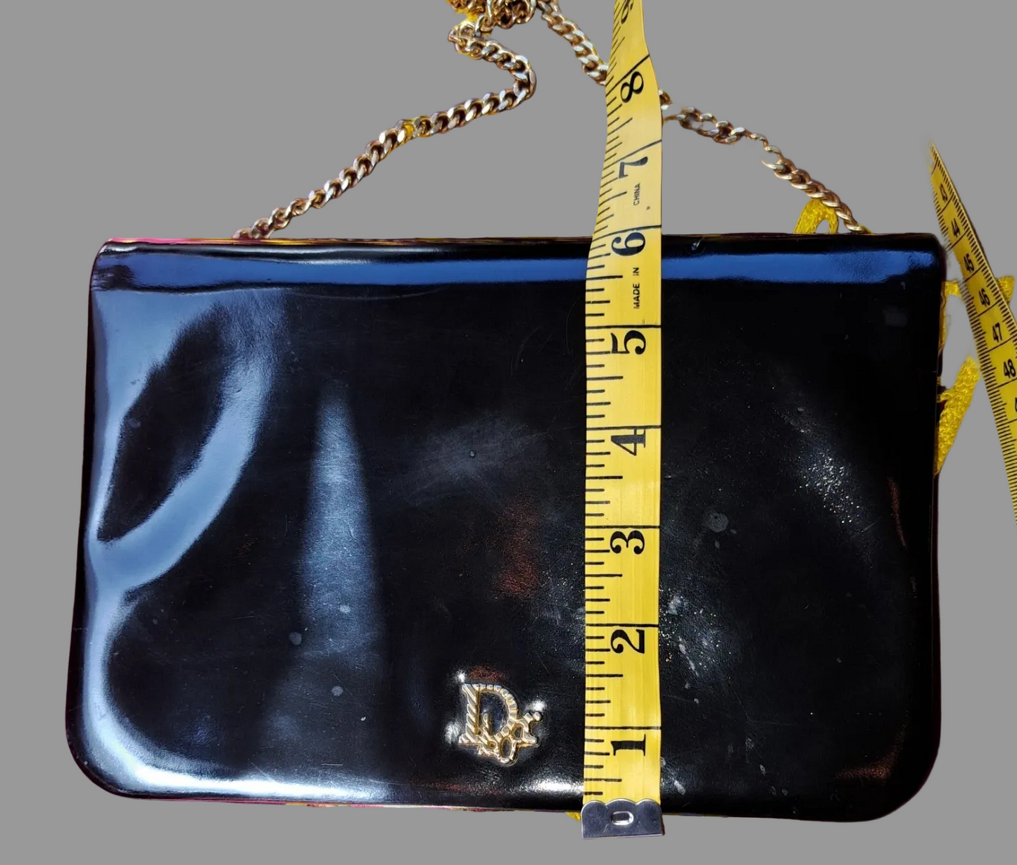 Dior shiny black leather two way envelope purse with a gold chain strap