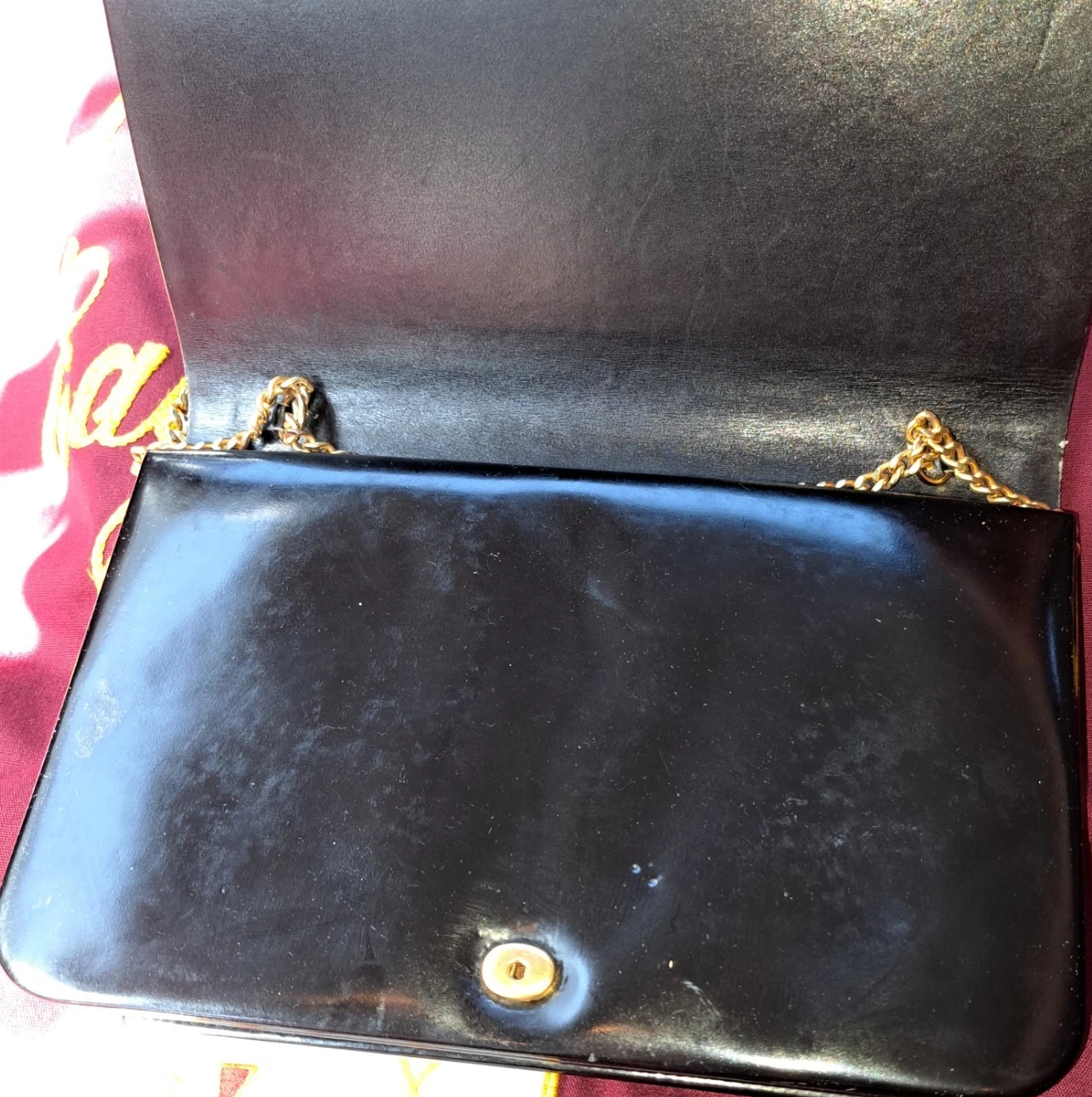 Dior shiny black leather two way envelope purse with a gold chain strap