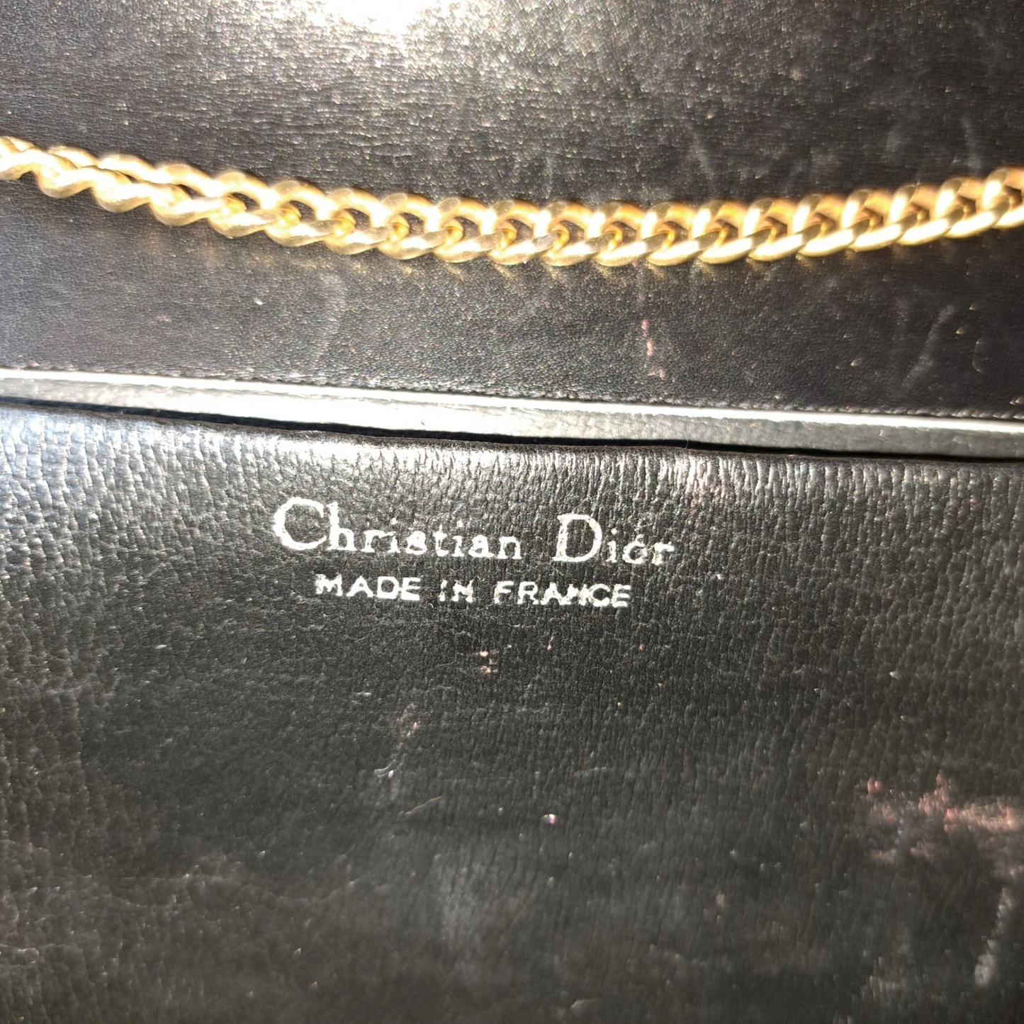 Dior shiny black leather two way envelope purse with a gold chain strap