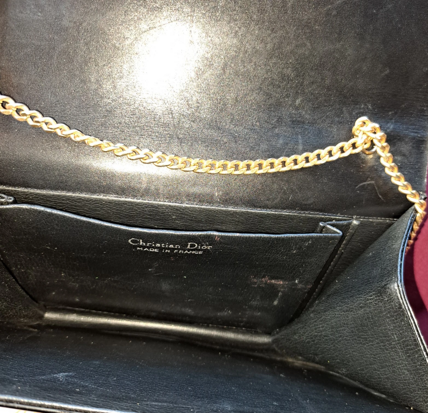 Dior shiny black leather two way envelope purse with a gold chain strap