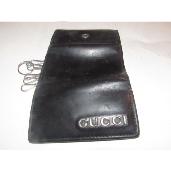 Gucci, black leather, snap close, tri-fold, key holder/card holder, mini- wallet w chrome accents & slots for your cards & six key holders