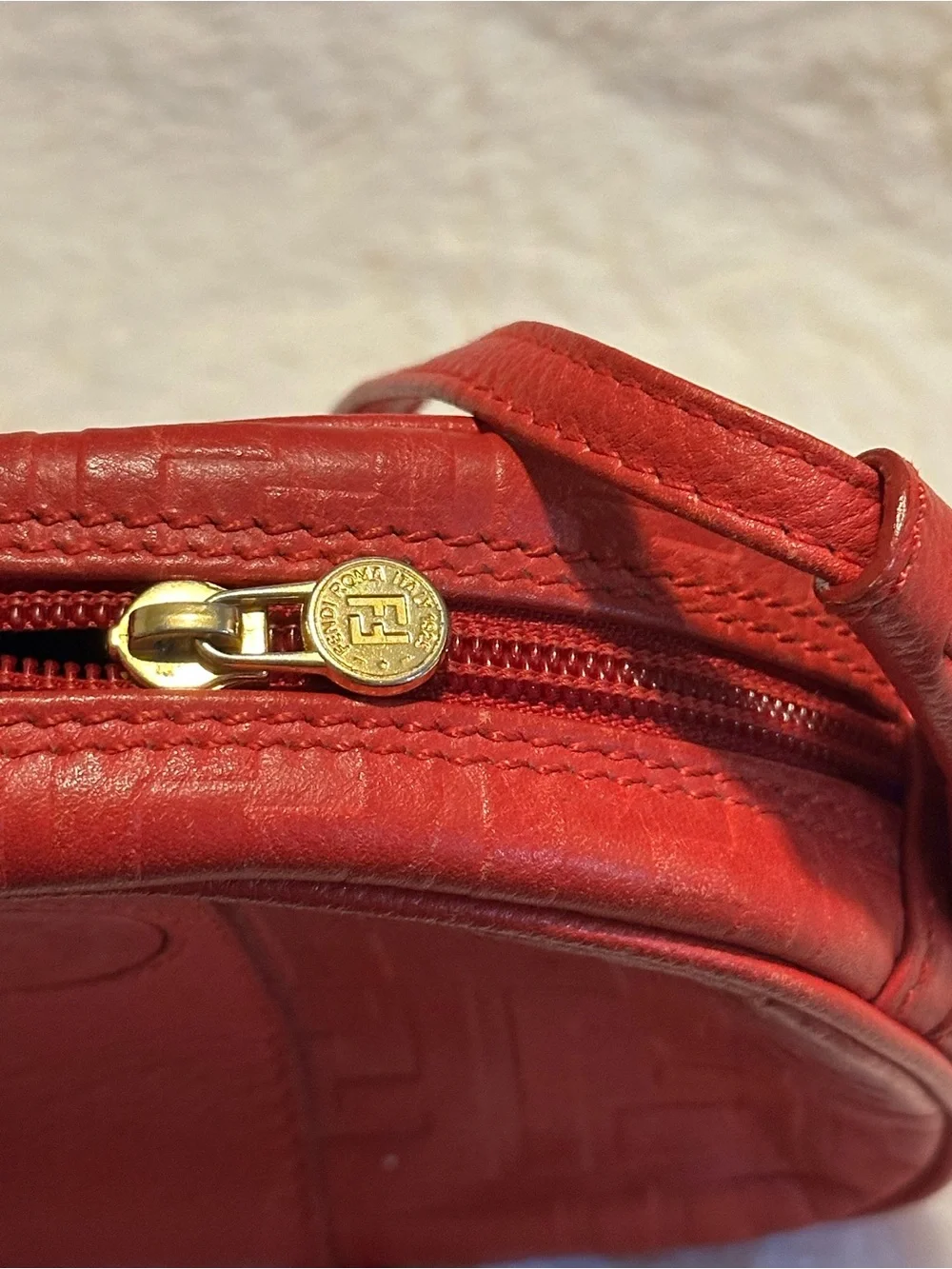 Fendi red Zucca print leather rounded top cross body