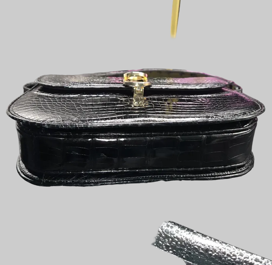 Gucci black crocodile leather shoulder purse with a bold gold 'G' accent