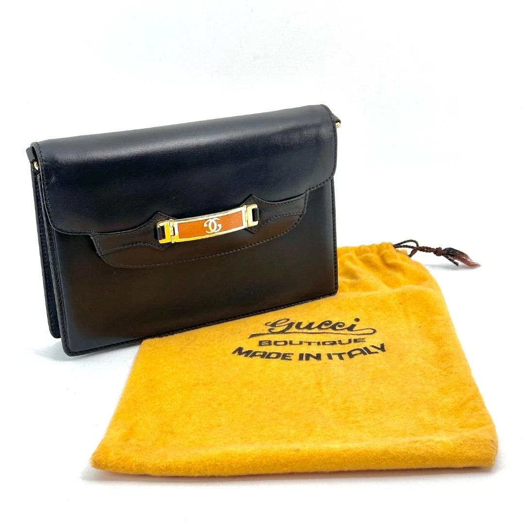 Gucci black leather two-way  mini purse with a yellow enamel clasp