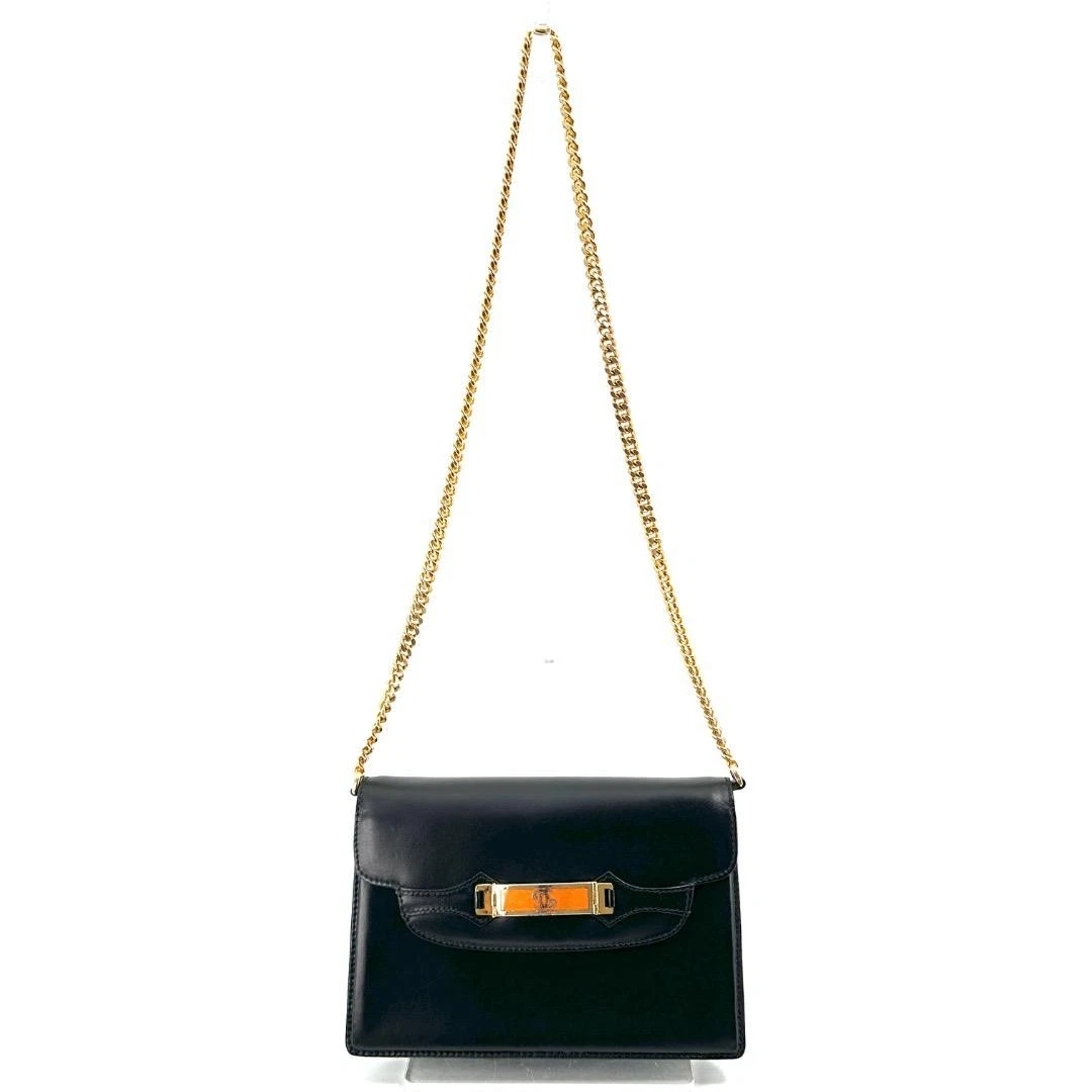 Gucci black leather two-way  mini purse with a yellow enamel clasp