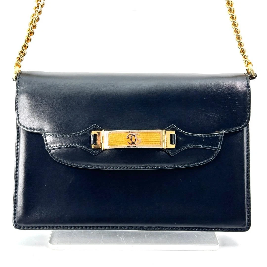 Gucci black leather two-way  mini purse with a yellow enamel clasp