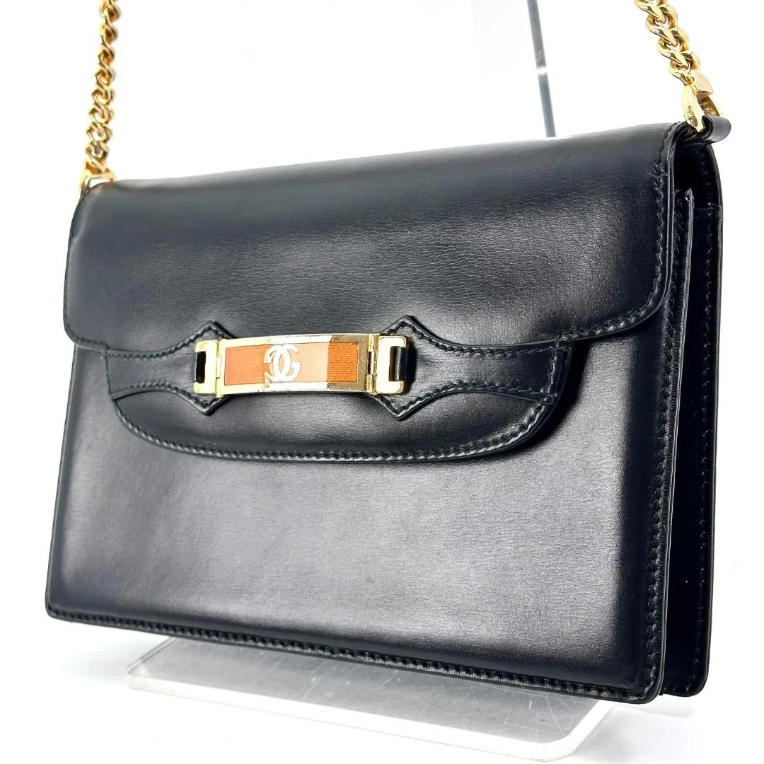 Gucci black leather two-way  mini purse with a yellow enamel clasp
