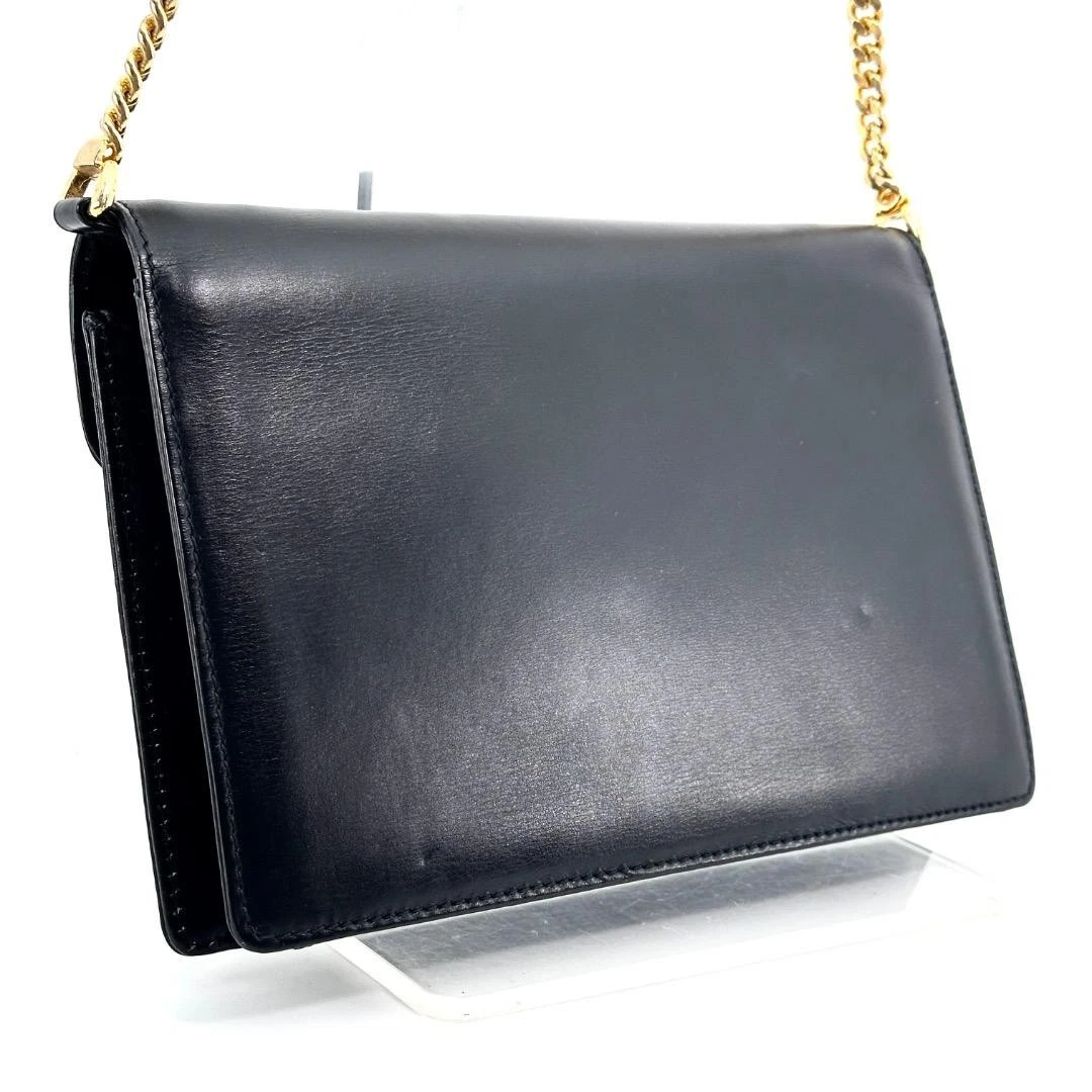 Gucci black leather two-way  mini purse with a yellow enamel clasp