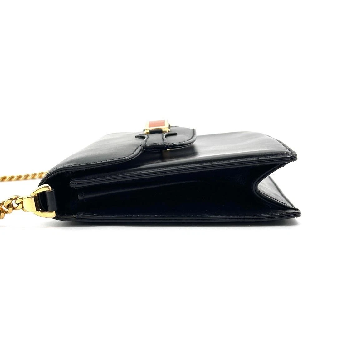 Gucci black leather two-way  mini purse with a yellow enamel clasp