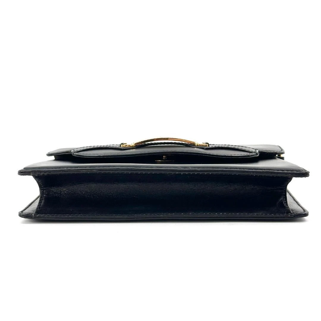 Gucci black leather two-way  mini purse with a yellow enamel clasp