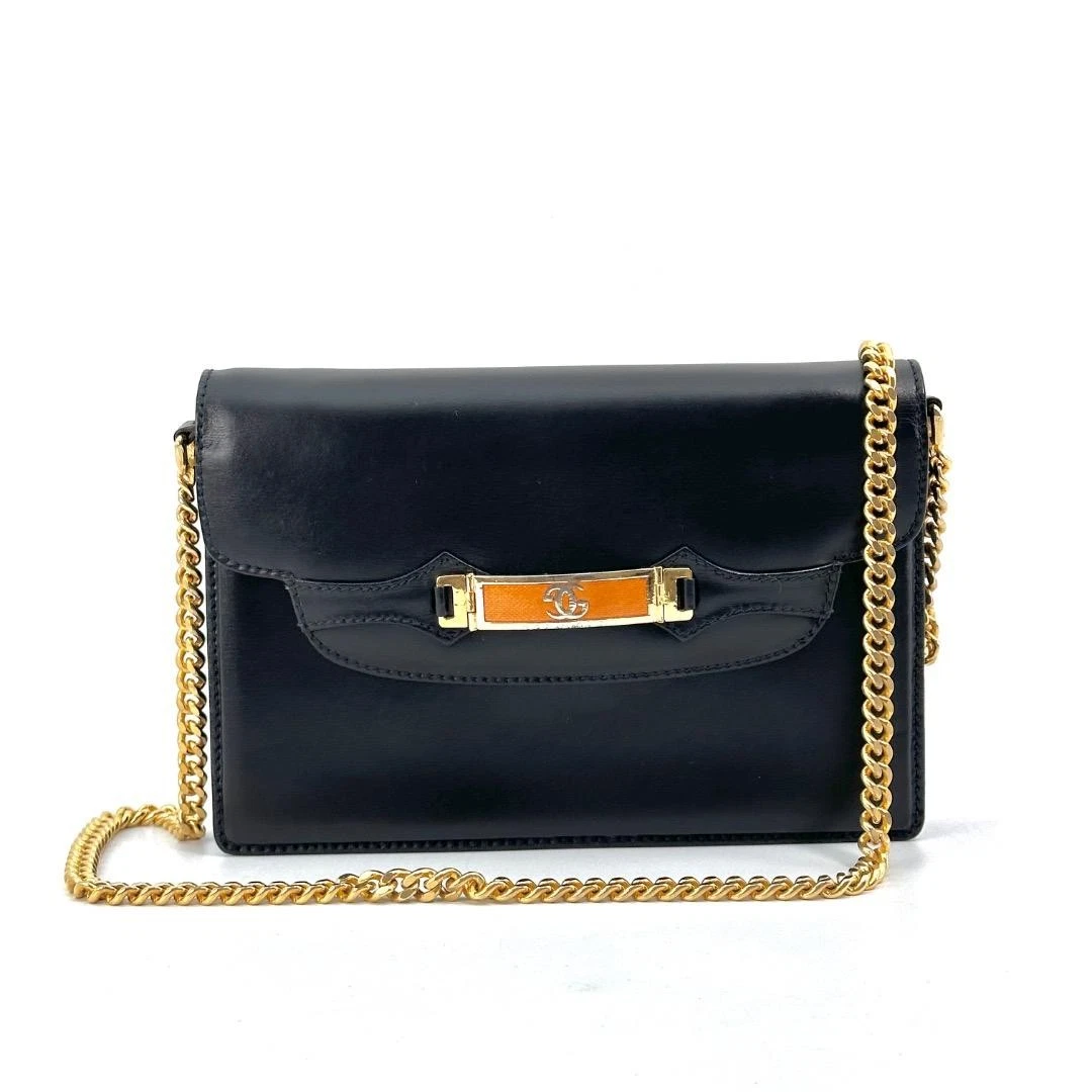 Gucci black leather two-way  mini purse with a yellow enamel clasp