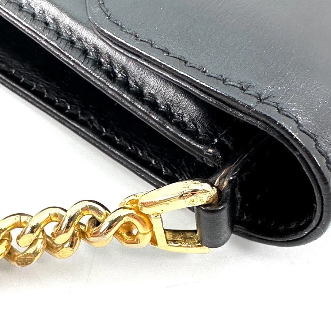 Gucci black leather two-way  mini purse with a yellow enamel clasp