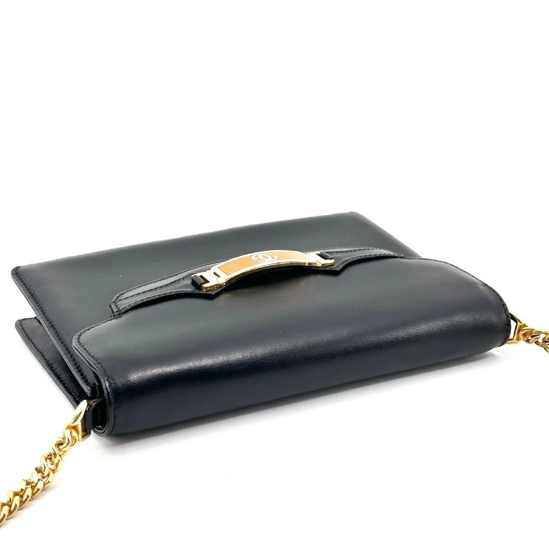 Gucci black leather two-way  mini purse with a yellow enamel clasp
