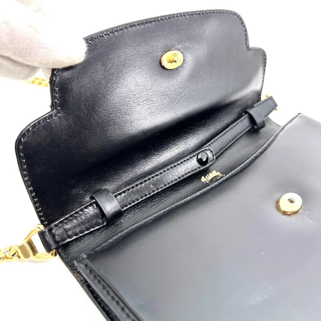 Gucci black leather two-way  mini purse with a yellow enamel clasp