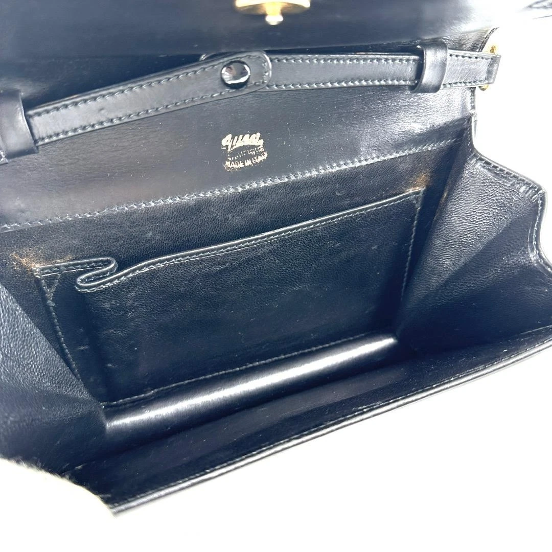 Gucci black leather two-way  mini purse with a yellow enamel clasp