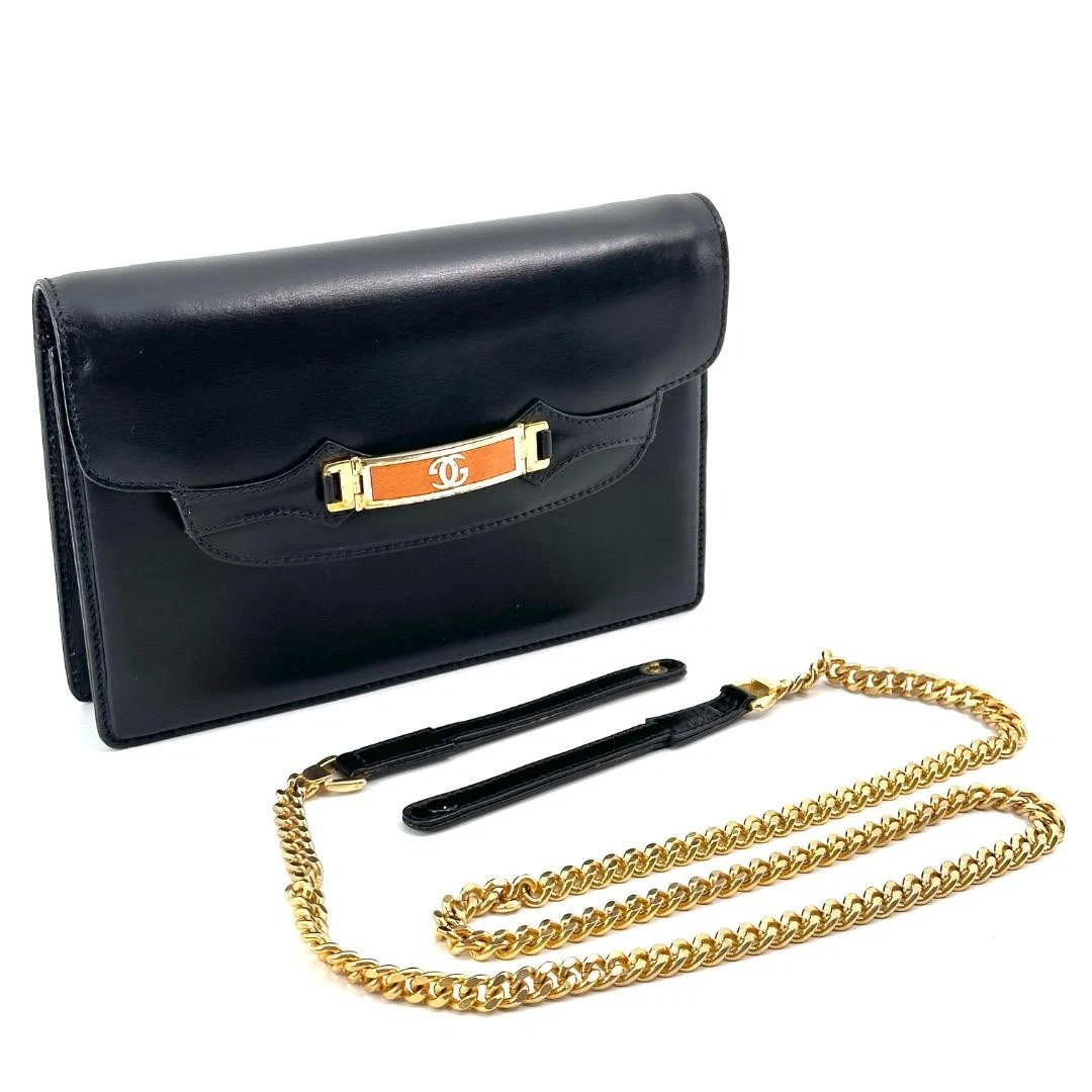 Gucci black leather two-way  mini purse with a yellow enamel clasp