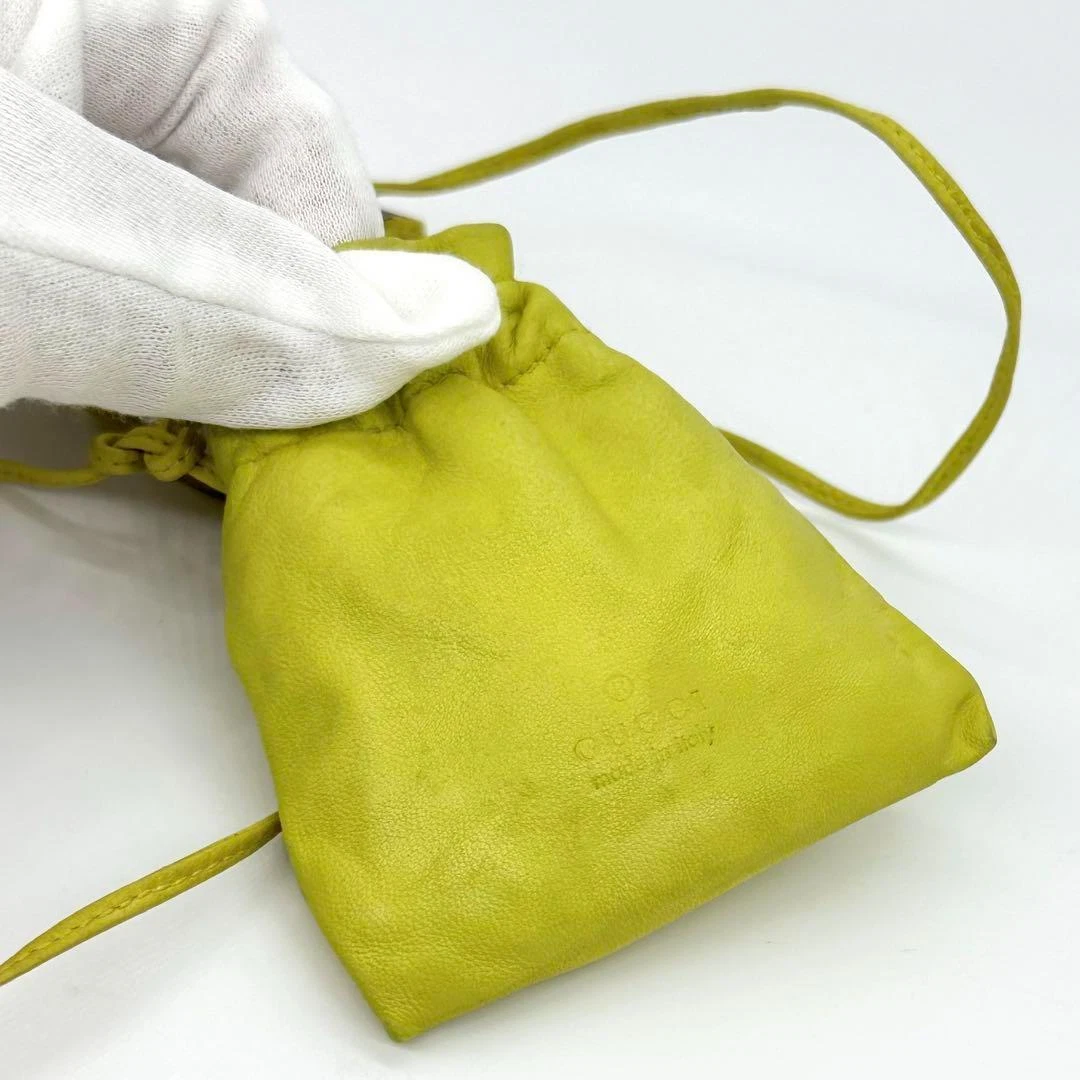 Gucci Tom Ford era yellow leather drawstring top pouch w silver Gucci dog tag