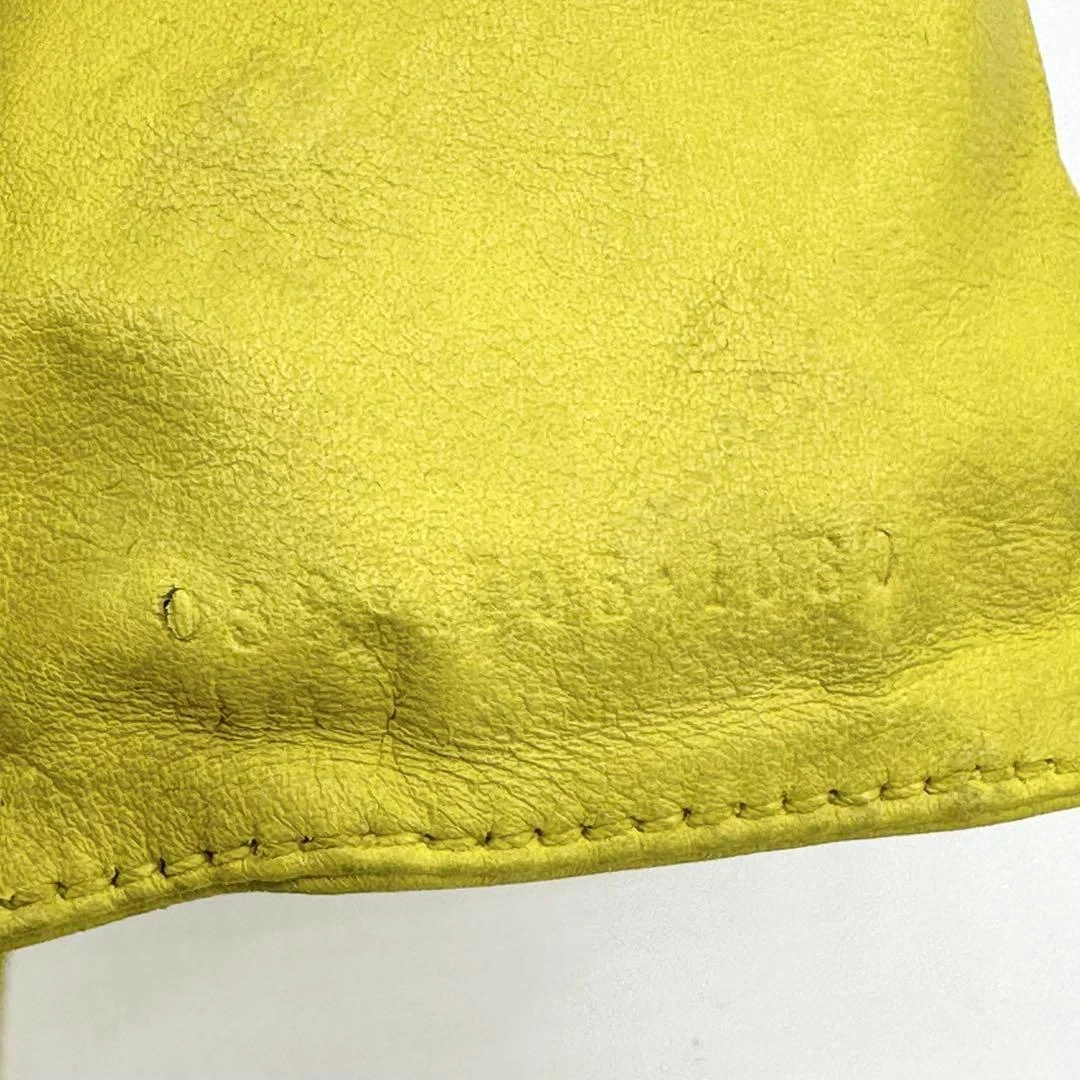 Gucci Tom Ford era yellow leather drawstring top pouch w silver Gucci dog tag