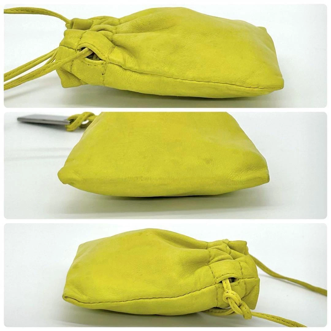 Gucci Tom Ford era yellow leather drawstring top pouch w silver Gucci dog tag