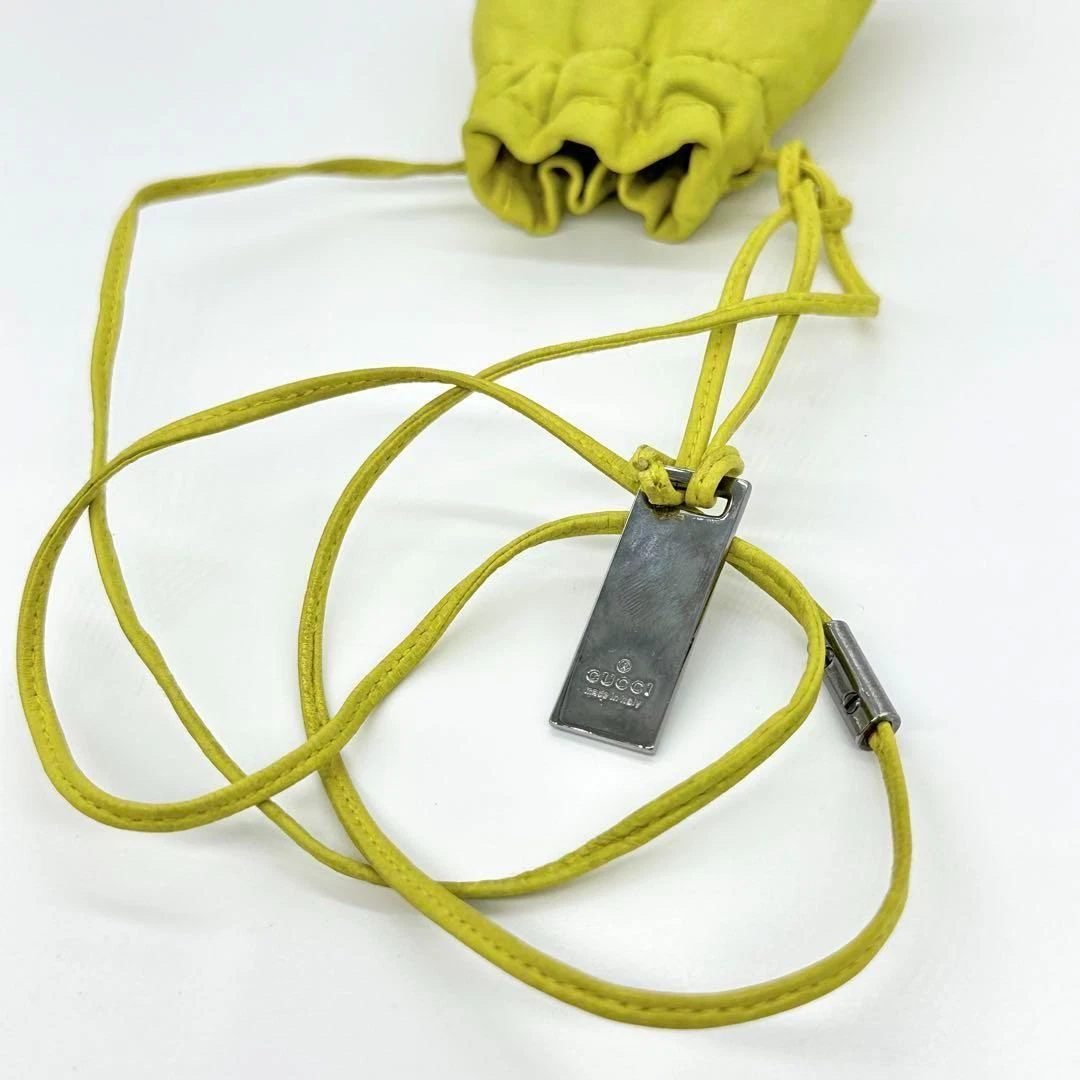 Gucci Tom Ford era yellow leather drawstring top pouch w silver Gucci dog tag