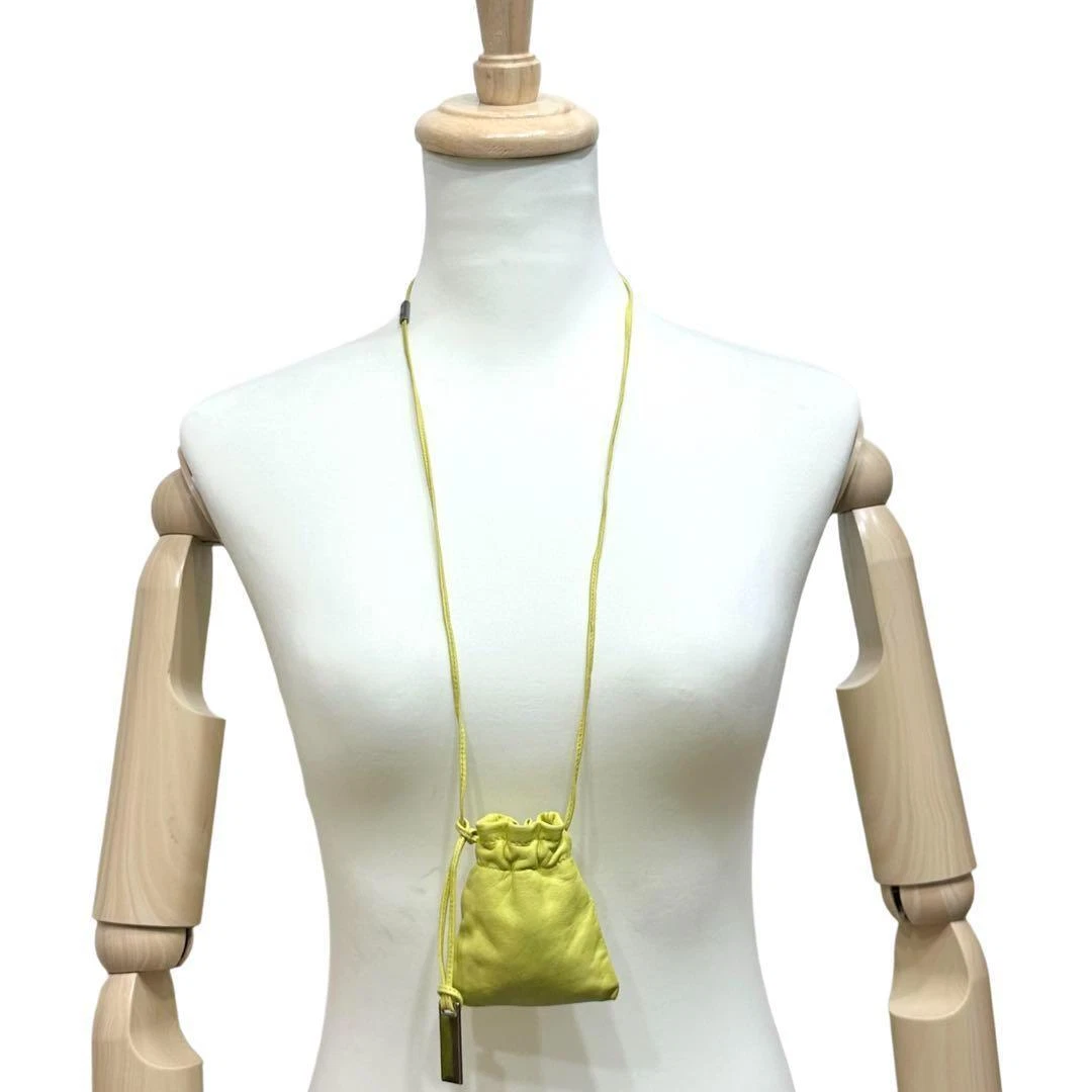 Gucci Tom Ford era yellow leather drawstring top pouch w silver Gucci dog tag