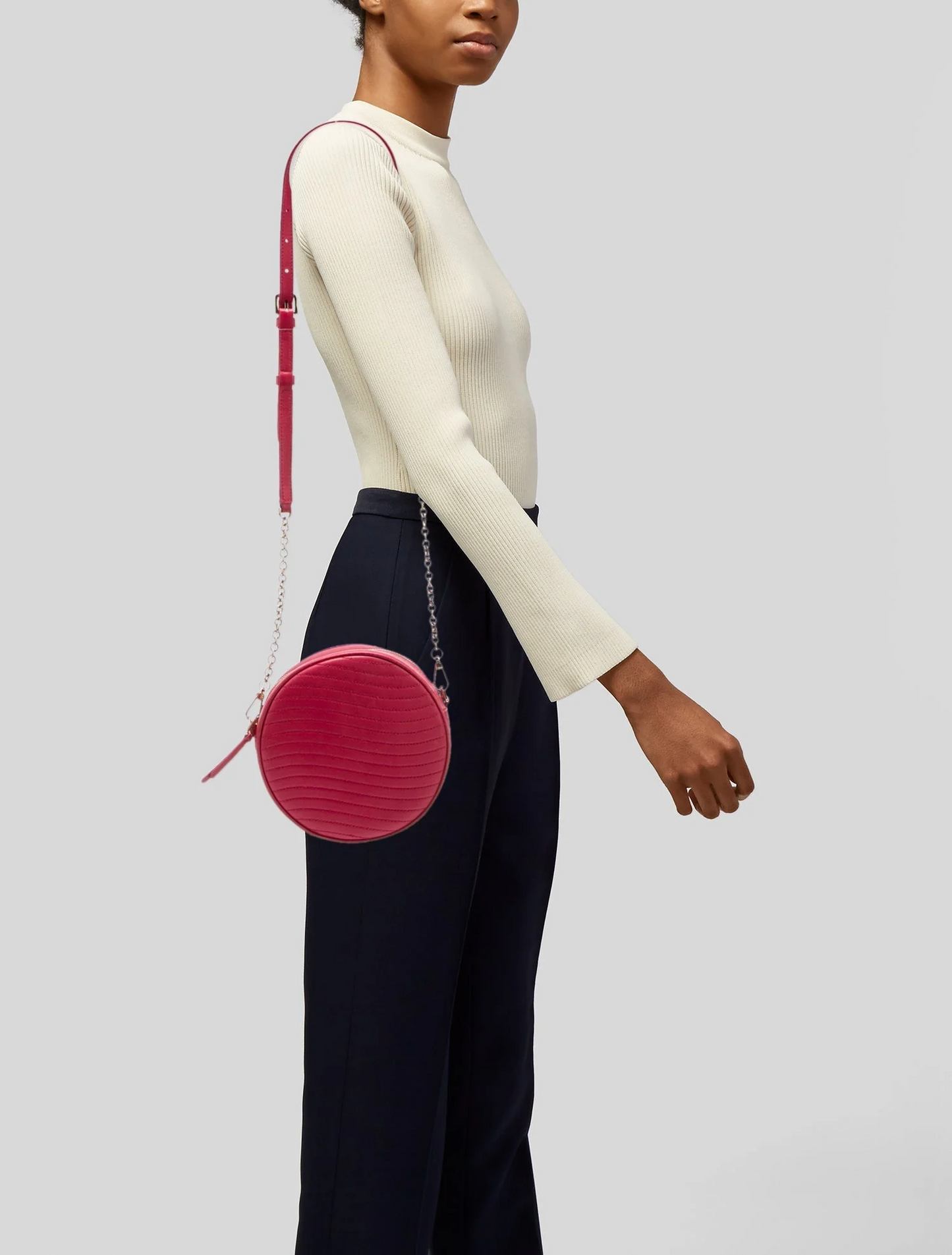 Furla pink leather round canteen style purse with a chain strap