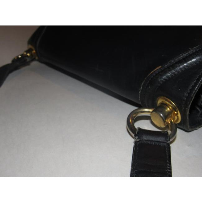 Vintage Gucci midnight blue leather 'Blondie' saddle style, shoulder bag with large, gold 'GG' emblem & multiple compartments