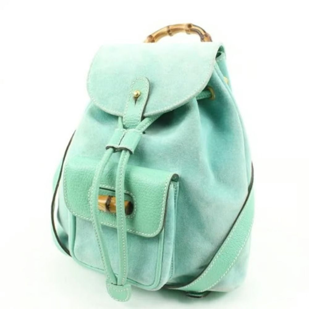 Tom Ford era, Gucci, aqua color, suede and leather, messenger bag/backpack with an exterior pocket, drawstring top closure