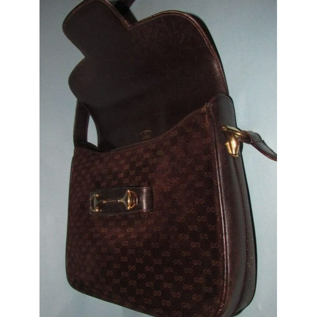 RARE, Gucci, mod, 1955 Horse-bit, dark brown micro Guccissima print embossed suede and leather shoulder bag with an envelope top, two strap lengths, and bold gold horse bit accents