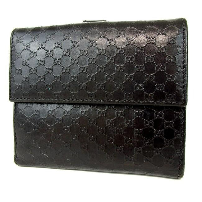 OUR MOST LIKED WALLET! Gucci, Jackie style, black micro Guccissima print leather, bi-fold wallet with chrome, Jackie style, push button closure, chrome accents, and lots of slots for your cards!