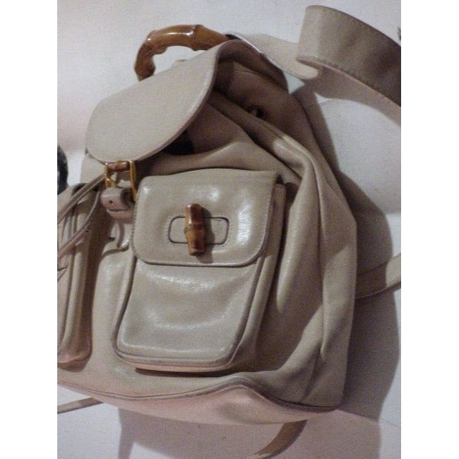 Gucci, white leather, larger size, two strap and bamboo handle, drawstring top, multi-pocket, messenger bag/backpack
