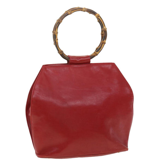 Vintage, mod look, Gucci, true red leather shopper with two round bamboo handles, a footed bottom, and gold accents