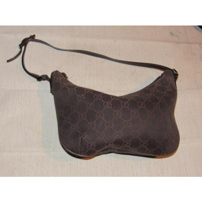 Gucci, petite, brown Guccissima print canvas & brown leather, hobo style, kidney shaped purse with chrome hardware & zip top closure