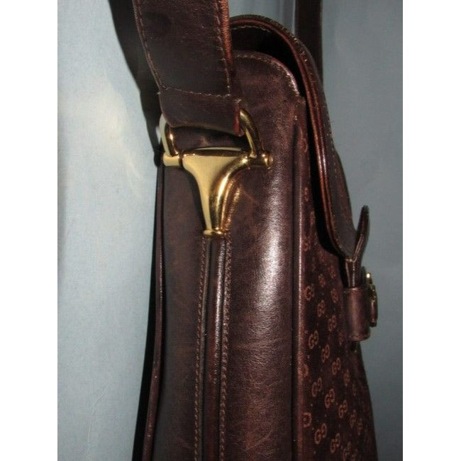 RARE, Gucci, mod, 1955 Horse-bit, dark brown micro Guccissima print embossed suede and leather shoulder bag with an envelope top, two strap lengths, and bold gold horse bit accents