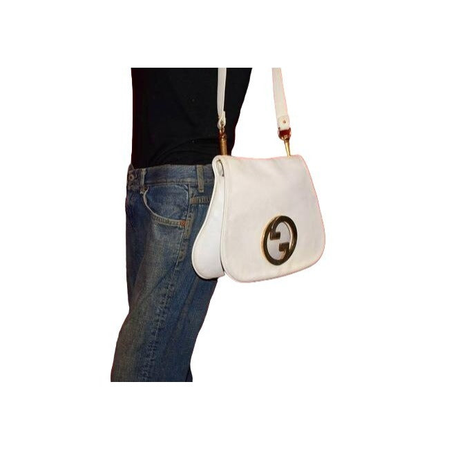 Vintage 1970s Gucci white textured leather Blondie style saddle bag with XL gold GG logo cutout in mint condition