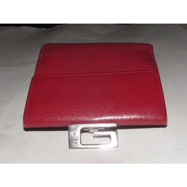 Gucci, true red leather, bi-fold, wallet with a change purse, gold G hinged closure, and lots of interior card slots