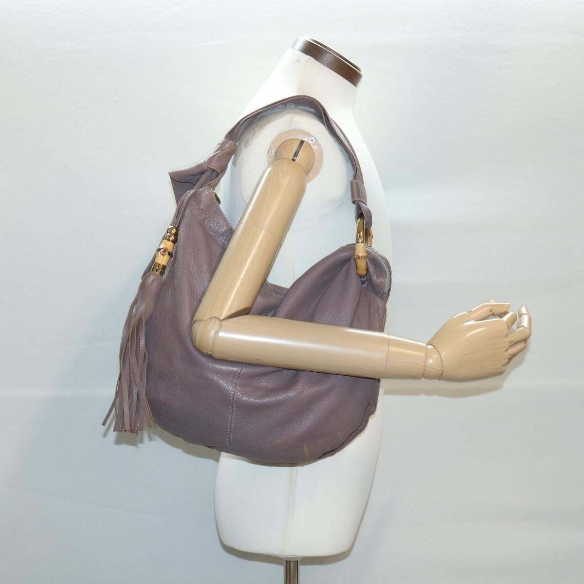 Bohemian, Gucci, supple mocha brown leather, XL hobo style, shoulder purse with gold & bamboo accents. a thick tassel zipper pull accent