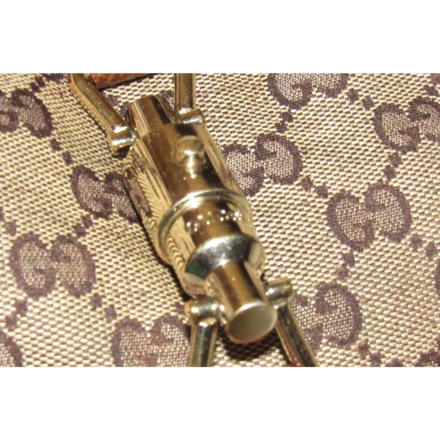 Vintage Gucci, brown Guccissima print fabric and leather, Jackie style shoulder bag with a gold piston clasp!
