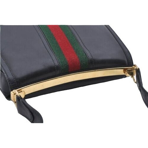 Vintage, RARE, Gucci, mod, black leather, saddle bag shoulder purse with a wide red & green center stripe, and bold gold accents g