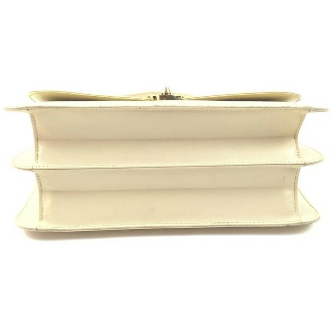 Vintage, Gucci, cream leather, 1973 top handle style purse with gold tone accents!