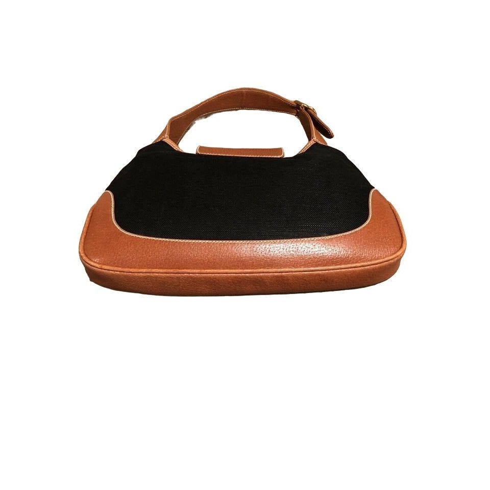 Original Gucci, 1961 Jackie hobo style shoulder bag, made in black linen canvas & camel leather with a gold piston closure & extender strap