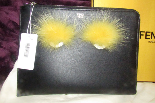 Fendi NIB w tags, black leather 'Monster' clutch w yellow fur lashes and zip around closure