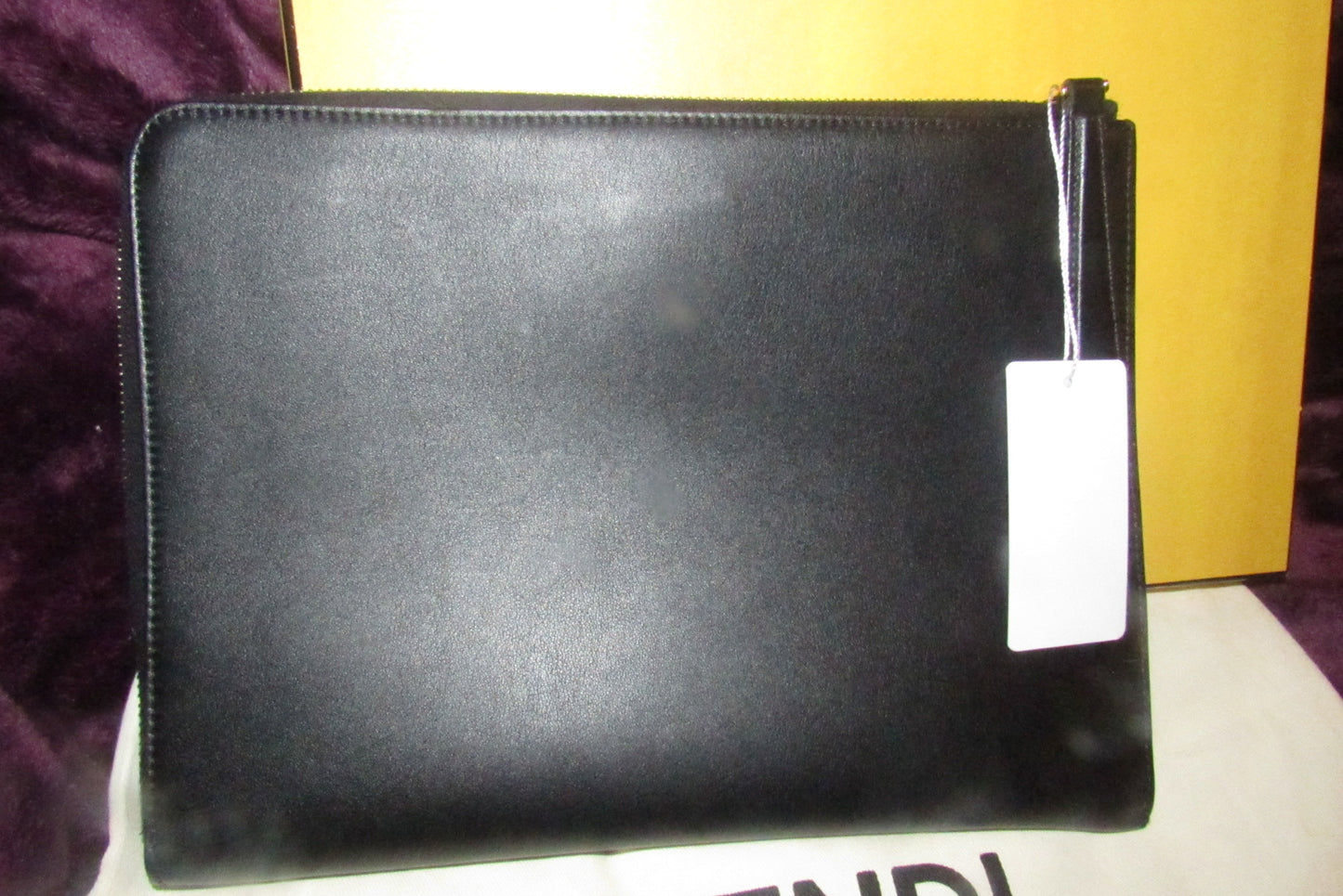 Fendi NIB w tags, black leather 'Monster' clutch w yellow fur lashes and zip around closure