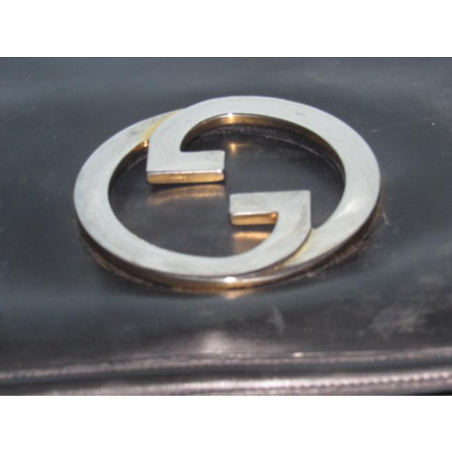 RARE, vintage, supple, black leather, Gucci 'Blondie' saddle bag style shoulder bag with an XL, gold 'GG' logo cut-out