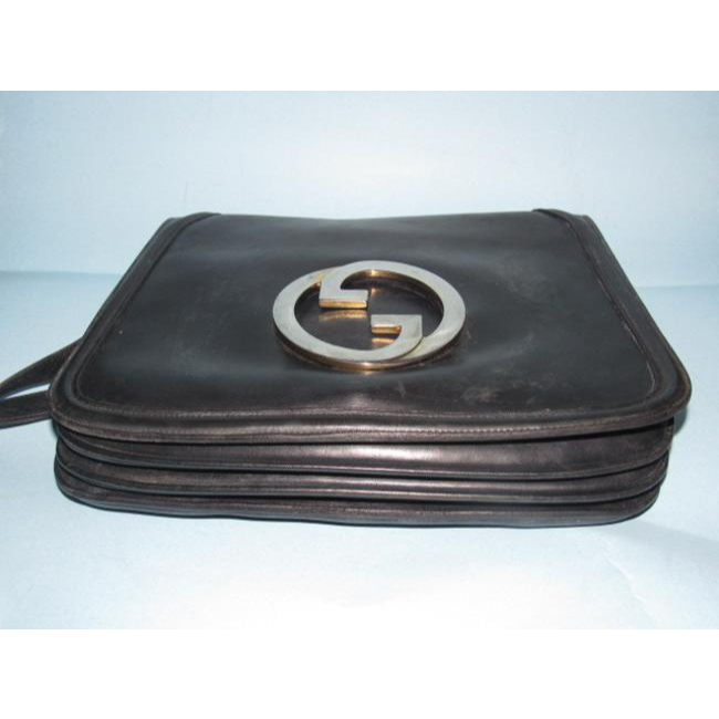 RARE, vintage, supple, black leather, Gucci 'Blondie' saddle bag style shoulder bag with an XL, gold 'GG' logo cut-out