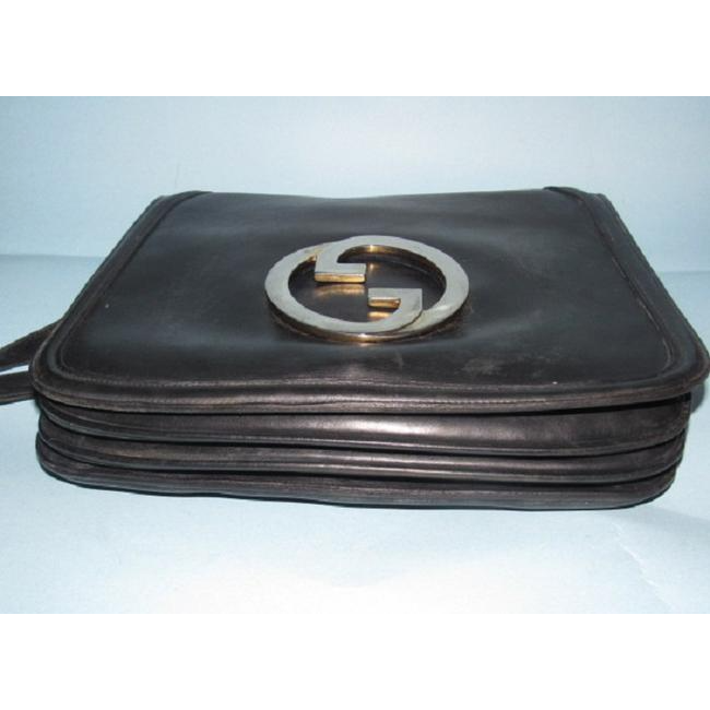 RARE, vintage, supple, black leather, Gucci 'Blondie' saddle bag style shoulder bag with an XL, gold 'GG' logo cut-out