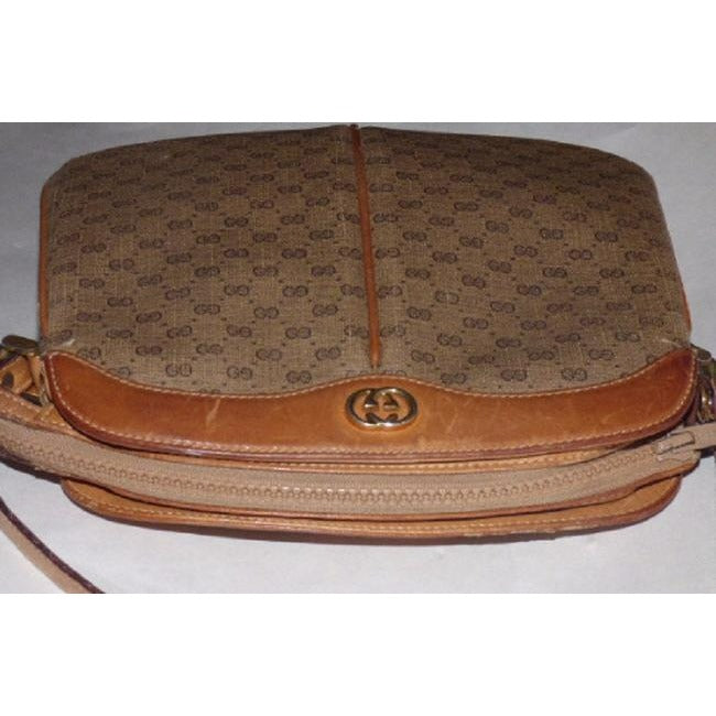 Gucci, brown micro Guccissima print coated canvas and camel leather cross body or shoulder bag with a zip top closure