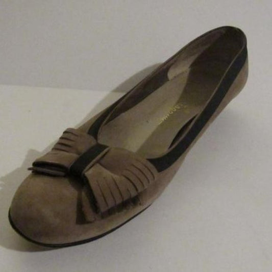 Salvatore Ferragamo VARA brown suede flats with black trim, large, fringe bows at the toes, and low, wedge heels