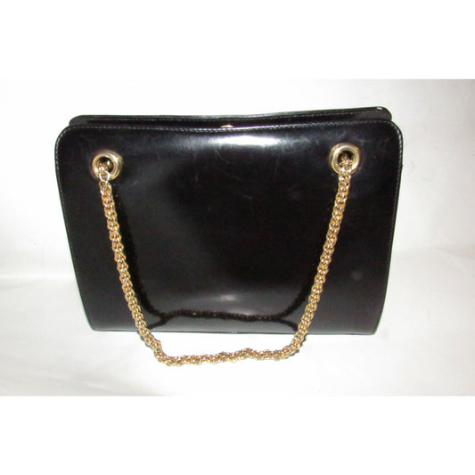 Rare 60s, mod, Giorgio Gucci, black leather, satchel style shoulder bag with a snap hinged top, two heavy gold chain shoulder straps